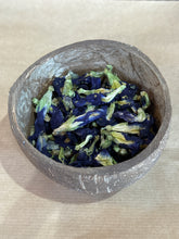 Load image into Gallery viewer, Dried blue butterfly pea flowers in a small bowl, used for natural blue herbal tea and Southeast Asian drinks.
