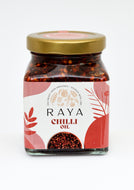 Jar of Raya Chilli Oil with a gold lid on a white background