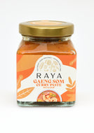 Jar of Raya Gaeng Som Curry Paste on a white background